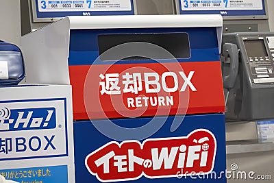 A Pocket Wifi Router rental return box at Narita International Airport Editorial Stock Photo