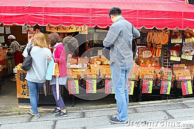 Narita, Japan, June 2018, Western women Japanese man shopping street food stores Editorial Stock Photo