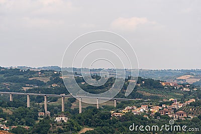 Narni Scalo Terni, Umbria, Italy - View of the industrial part of the city, highway bridge, distant view Stock Photo