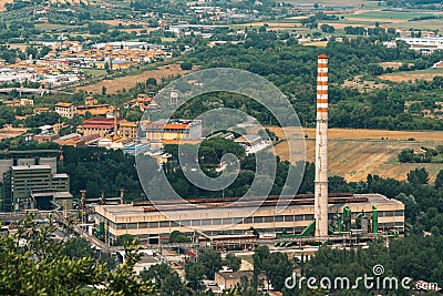 Narni Scalo Terni, Umbria, Italy - View of the industrial part of the city, Plant with smoke tube, distant view Stock Photo