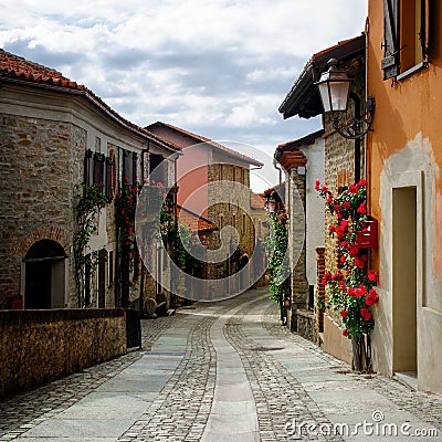 Narrow alley in Bossolasco, village of the roses Piedmont, Italy Stock Photo