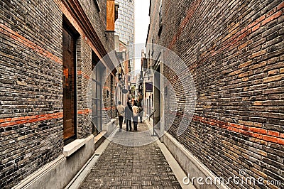 Narrow alley with brick walls, Xintiandi, Shanghai Editorial Stock Photo