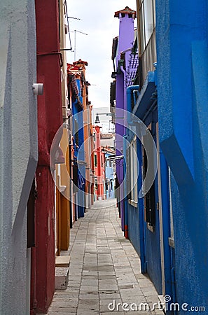 Narrow alley on the Burano island Stock Photo