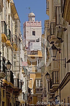 Small street in Cadiz with tradtitional houses and moorish style tower Editorial Stock Photo