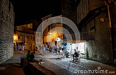 Narrow Alley With Illuminated Ancient Buildings In The Ancient Fortress Of Medieval City Carcassonne In Occitania, France Editorial Stock Photo