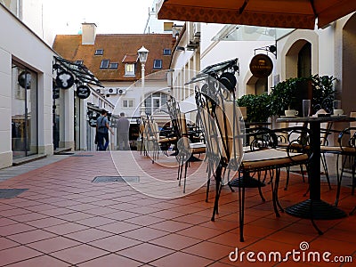 narrow alley and passage way with street terrace, tables and chairs Editorial Stock Photo