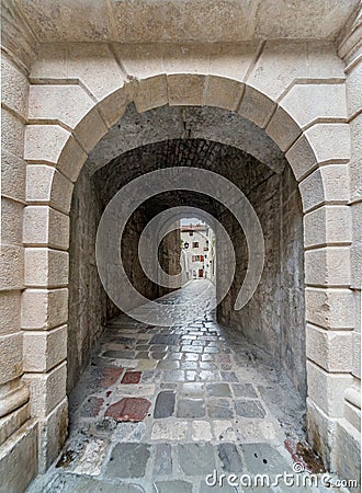 Narrow archway in the ancient streets of Kotor Old Town Montenegro Stock Photo