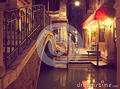 Narrow canal in Venice at night, Italy. Stock Photo