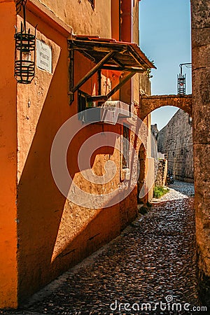 Narrow ancient cobblestone street in rodos greece Stock Photo