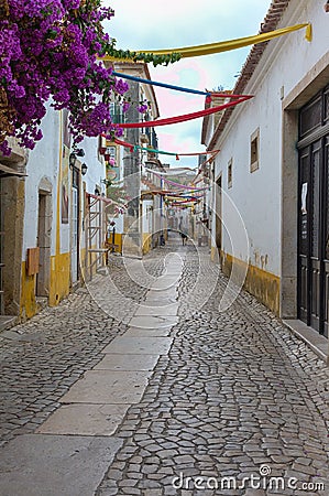 Narrow Colorful Street in the Medieval Portuguese City of Obidos Editorial Stock Photo