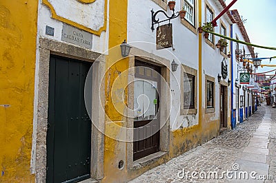 Narrow Colorful Street in the Medieval Portuguese City of Obidos Editorial Stock Photo