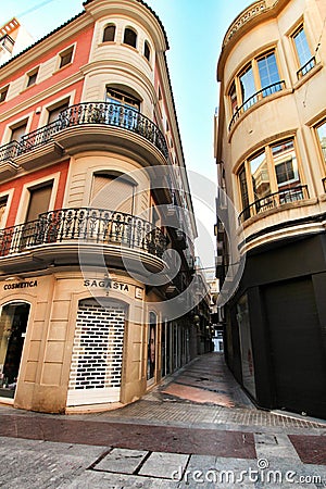 Narrow and colorful streets, facades and balconies in Elche city Editorial Stock Photo