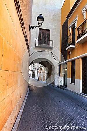 Narrow and colorful streets, facades and balconies in Elche city Editorial Stock Photo