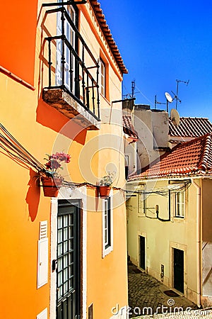 Narrow and colorful streets, facades and balconies of Lisbon Stock Photo