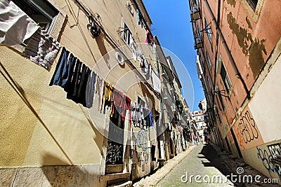 Narrow and colorful streets of Lisbon on a sunny day Editorial Stock Photo