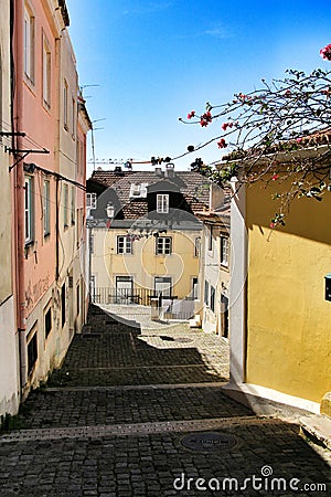 Narrow and colorful streets, facades and balconies of Lisbon Stock Photo