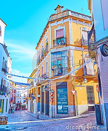 The narrow descent of Calle Rodriguez Marin street, on Sep 30 in Cordoba, Spain Editorial Stock Photo