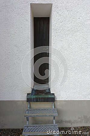 Narrow entrance door Stock Photo