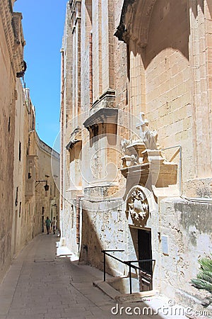 Mdina, Malta, August 2015. Entrance to the Catholic chapel on the narrow street of the old city. Editorial Stock Photo