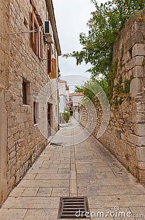 Narrow medieval street in Trogir, Croatia Stock Photo
