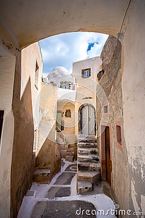 Narrow neighborhood at the old traditional village of Emporio, Santorini. Stock Photo