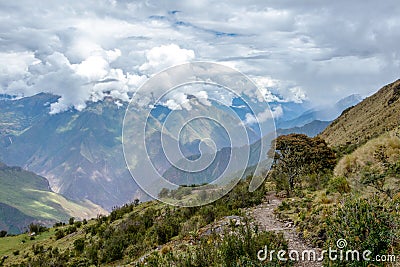 Narrow path on the hiking trail at high altitude Peruvian mountains between Maizal and Yanama, Peru Stock Photo