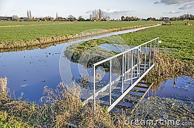 Narrow steel hikers bridge Stock Photo