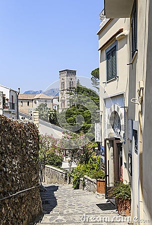 A narrow steep street with blooming oleanders in Ravello Editorial Stock Photo