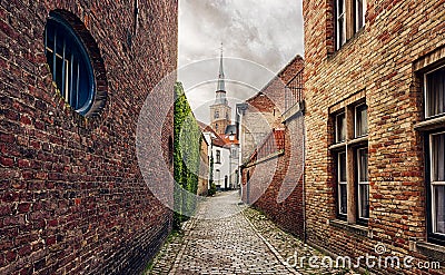 Narrow street in Bruges, Belgium Stock Photo