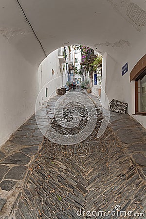 Narrow street in historical center of Cadaques, Spain Editorial Stock Photo