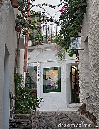 Narrow street in historical center of Cadaques, Spain Editorial Stock Photo