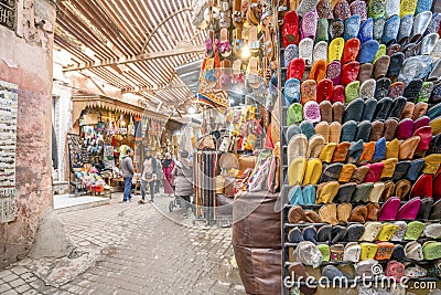 Narrow street in medina of Marrakech full of shops with souvenirs Editorial Stock Photo