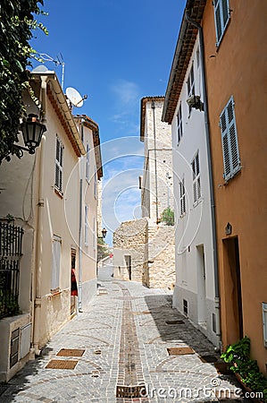 Narrow street in old town of Antibes, French Riviera, Provence, France Stock Photo