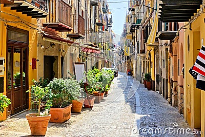 Narrow street in the old town of Cefalu, Sicily, Italy Stock Photo