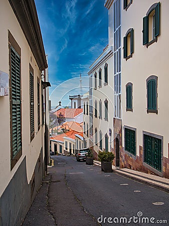 A narrow street on a sunny day in the Old Town area of Funchal on the island of Maderia, Portugal Editorial Stock Photo