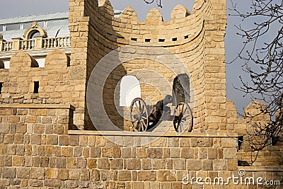 Narrow streets of the old city, ancient buildings and walls. Baku, Azerbaijan anicient cannon Stock Photo