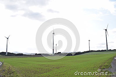 wind power plants on green hills Editorial Stock Photo