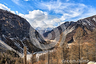 Narrow valley of Irkut River. In background is an array of Munku-Sardyk. Okinsky District. Republic of Buryatia. Russian Federatio Stock Photo