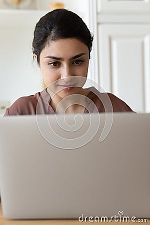 Narrow view of Indian woman use laptop Stock Photo
