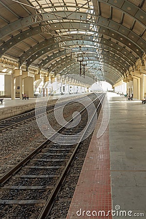 Narrow view of a locomotive electric train station platform with covered tunnel, Chennai, India, Mar 29 2017 Editorial Stock Photo