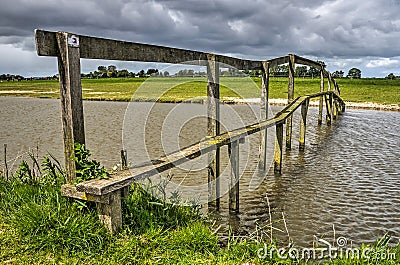 Narrow wooden hiking bridge Stock Photo