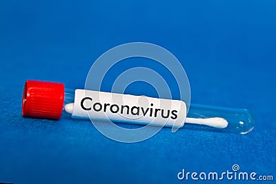 Nasal tampon test on a blue background with the inscription coronavirus Stock Photo
