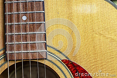 Nashville Acoustic Guitar Sound Hole, slanted with strings and detail of wood grain and design Stock Photo
