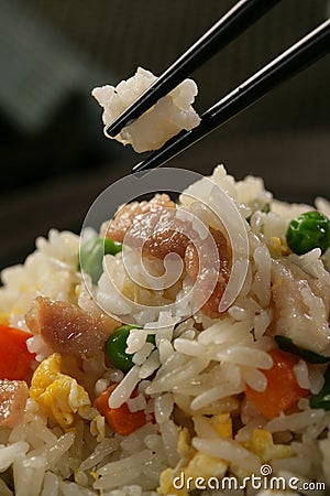 Nasi goreng with pork stripes and chopsticks Stock Photo