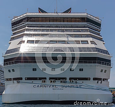 Nassau, Bahamas - May 14, 2019: Carnival Sunrise cruise ship docked at Prince George Wharf. Blue mooring lines leading to the pier Editorial Stock Photo