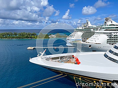 The Disney Fantasy, and two Royal Caribbean cruise ships docked at the Nassau, Bahamas port for the day Editorial Stock Photo