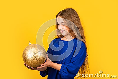 National colors of Ukraine. Blue and yellow. Shimmering glitter. Prepare decorations in advance. Girl hold golden ball Stock Photo