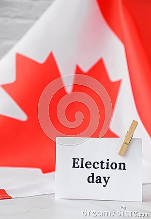 The National Flag of Canada. Canadian Flag or the Maple Leaf with paper note message text. Election day, give vote, your Stock Photo