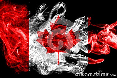 National flag of Canada made from colored smoke isolated on black background. Abstract silky wave background. Stock Photo