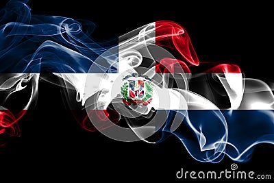 National flag of Dominican Republic made from colored smoke isolated on black background. Abstract silky wave background Stock Photo